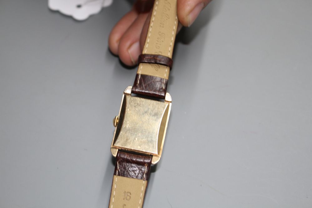 A gentlemans early 1950s 9ct gold Rotary manual wind wrist watch, the rectangular dial with Arabic numerals and subsidiary seconds,